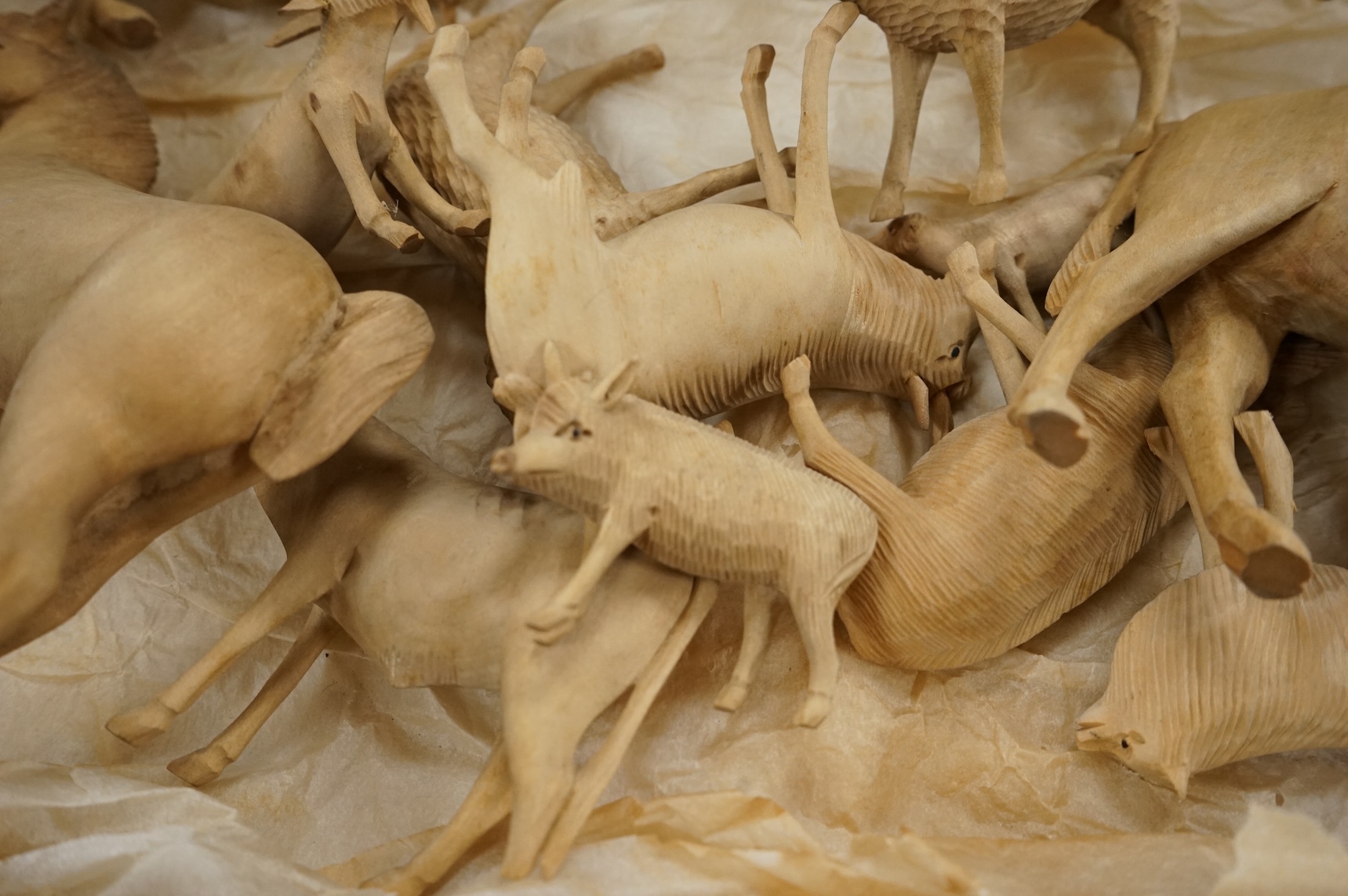 A collection of carved wood farm animals, largest 15.5cm